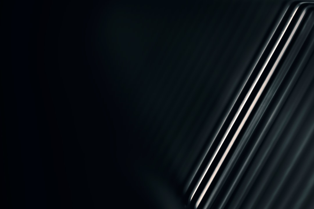 a close up of a cell phone on a black background